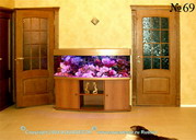 Декоративный аквариум с использованием в оформлении кораллов и известняка. Фасад тумбы облицован шпоном.