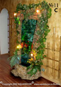 Водная панель от АКВА-ДЕКОР с оформлением стены помещения бамбуком.